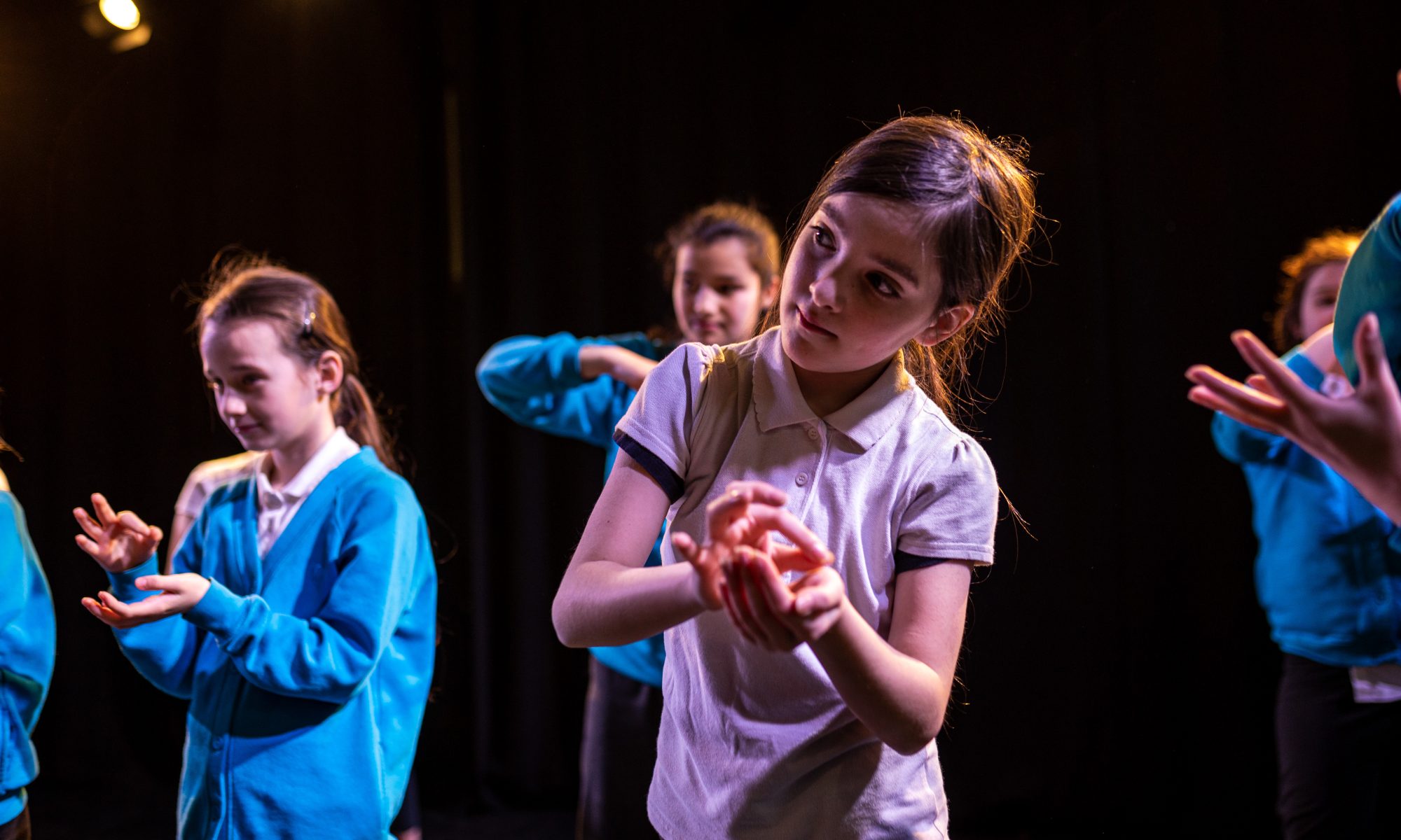 Schoolchildren taking part in a movement workshop