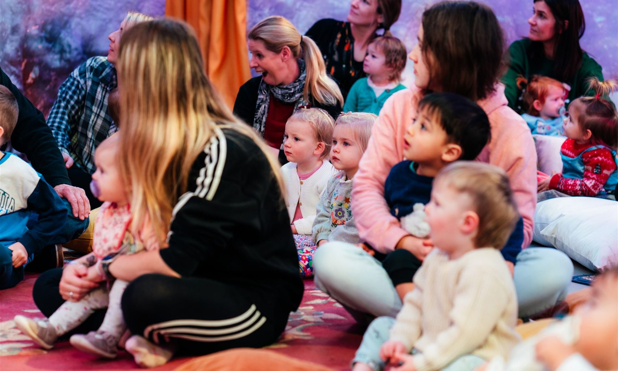 An audiences of young families watching Timothy The Yeti at The Point